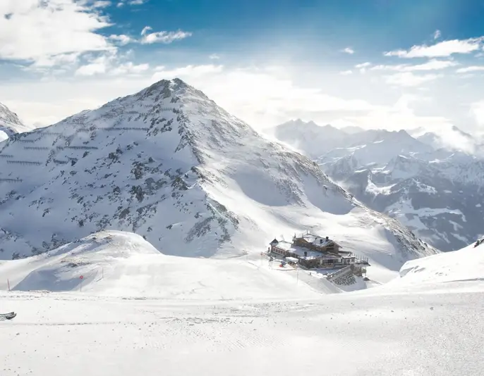Man skiing on the prepared slope with fresh new powder snow in Alps