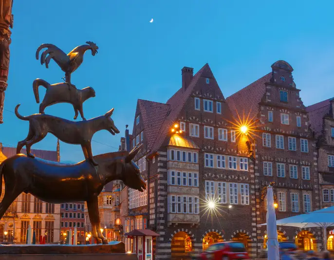 Famous statue of The Bremen Town Musicians, donkey, dog, cat and cockerel, from Grimm's famous fairy tale in the center of Old Town near Bremen City Hall, Bremen, Germany