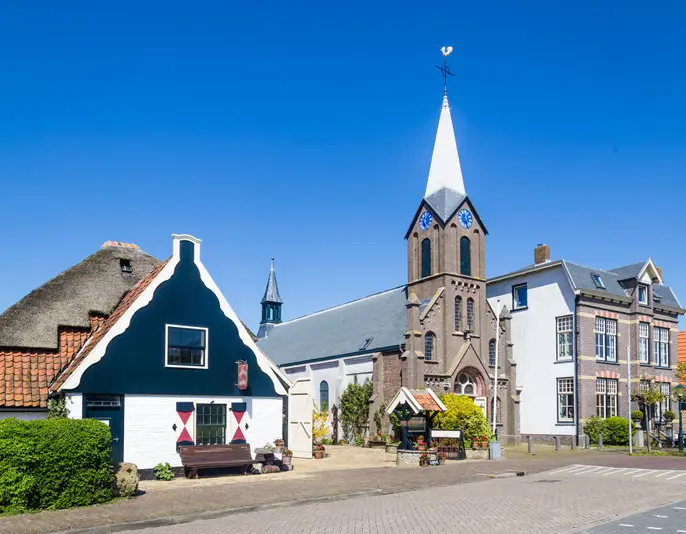 Village Oudeschild with Martinus church and trraditional gable  houses on the Wadden island Texel in the Netherlands