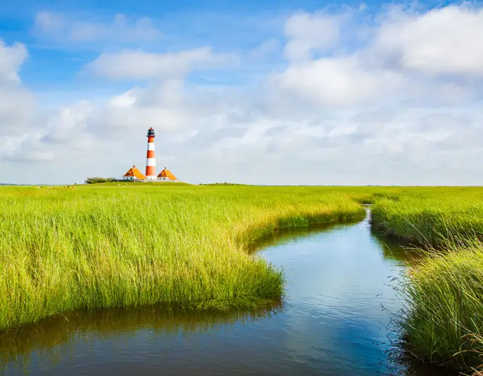 Beautiful view of famous Westerheversand on a sunny day with blue sky and clouds in summer, North Sea, Schleswig-Holstein, Germany